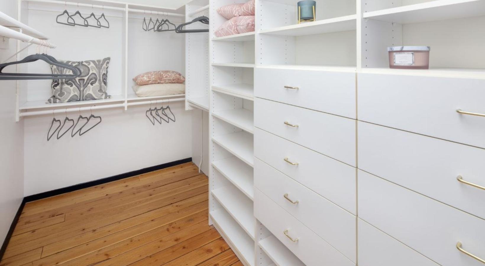 Beautiful bedrooms to fit every need a closet with cabinets, shelves and hangers