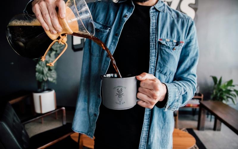 a man holding a coffee cup