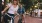 a woman and a man riding a bicycle