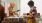 a man and a woman looking at vinyls