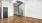 a living room with a staircase and a wood floor