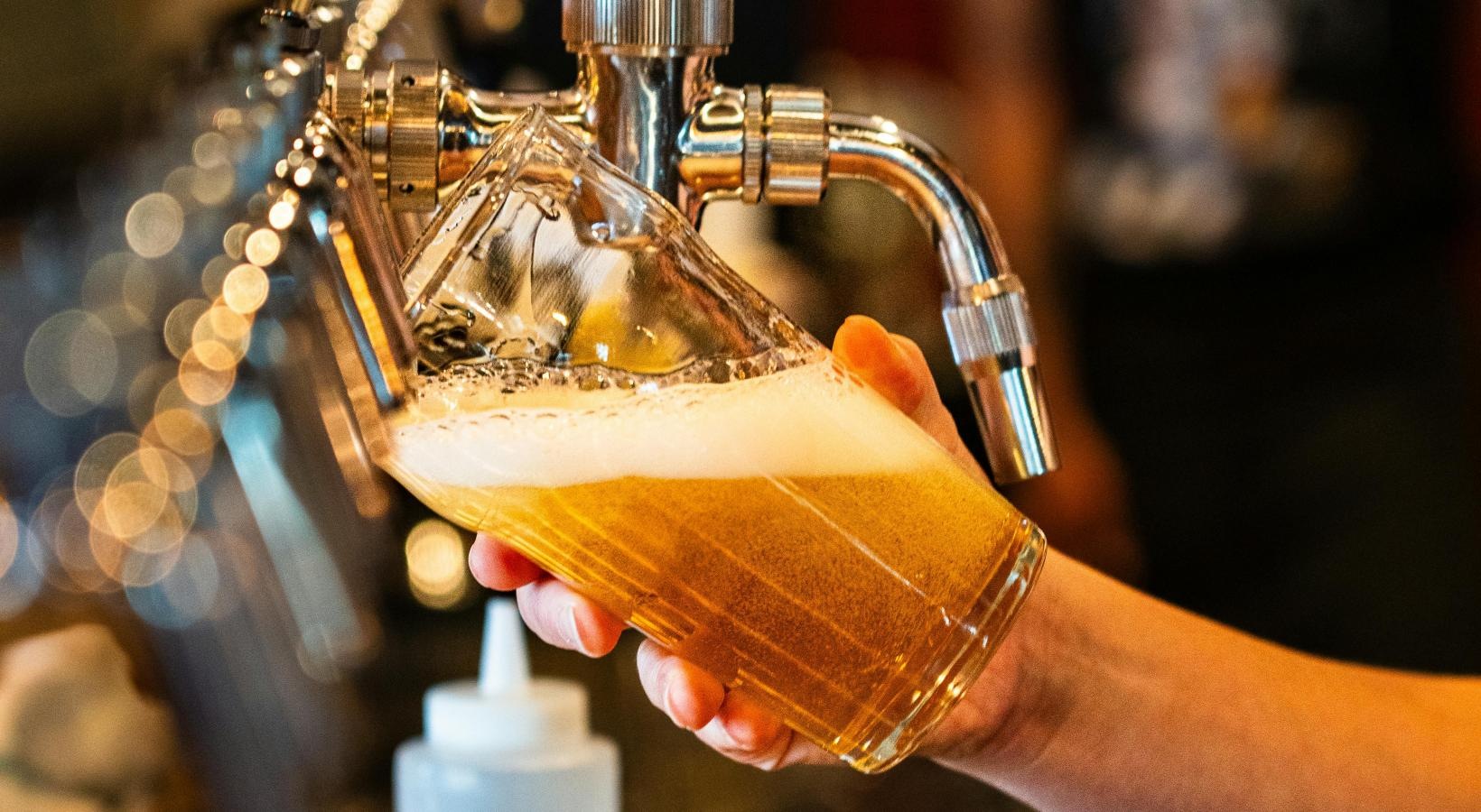 Find your perfect fit at Honeyman Hardware Lofts a person pouring liquid into a bottle