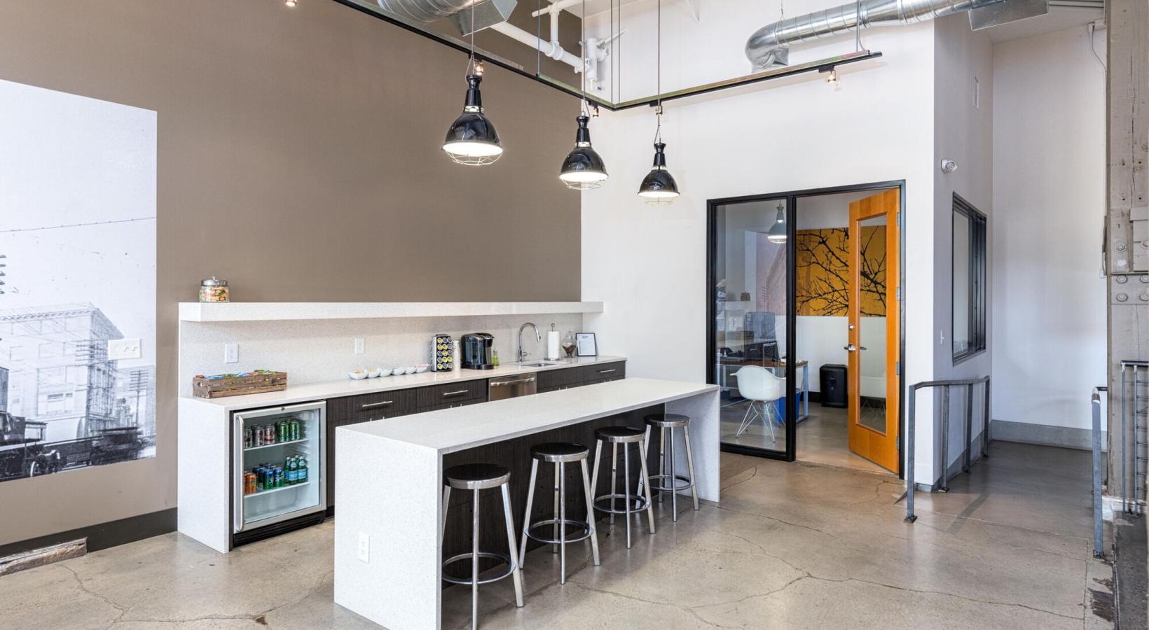 Vibrant community life with a variety of dining options a kitchen with stools and a bar