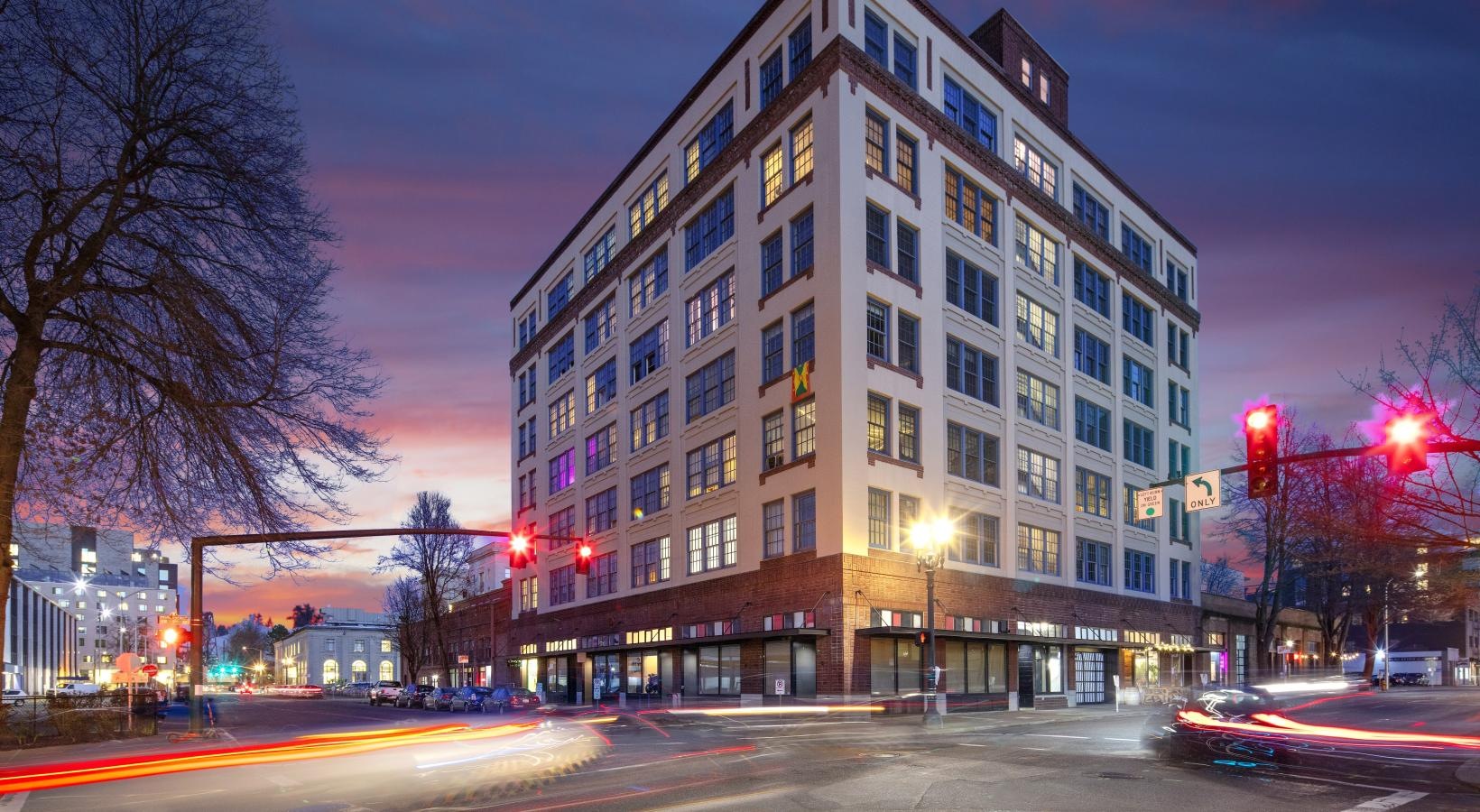 Find your perfect fit at Honeyman Hardware Lofts a large building with a street in front of it