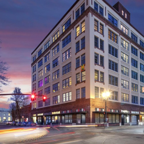 Find your perfect fit at Honeyman Hardware Lofts a large building with a street in front of it