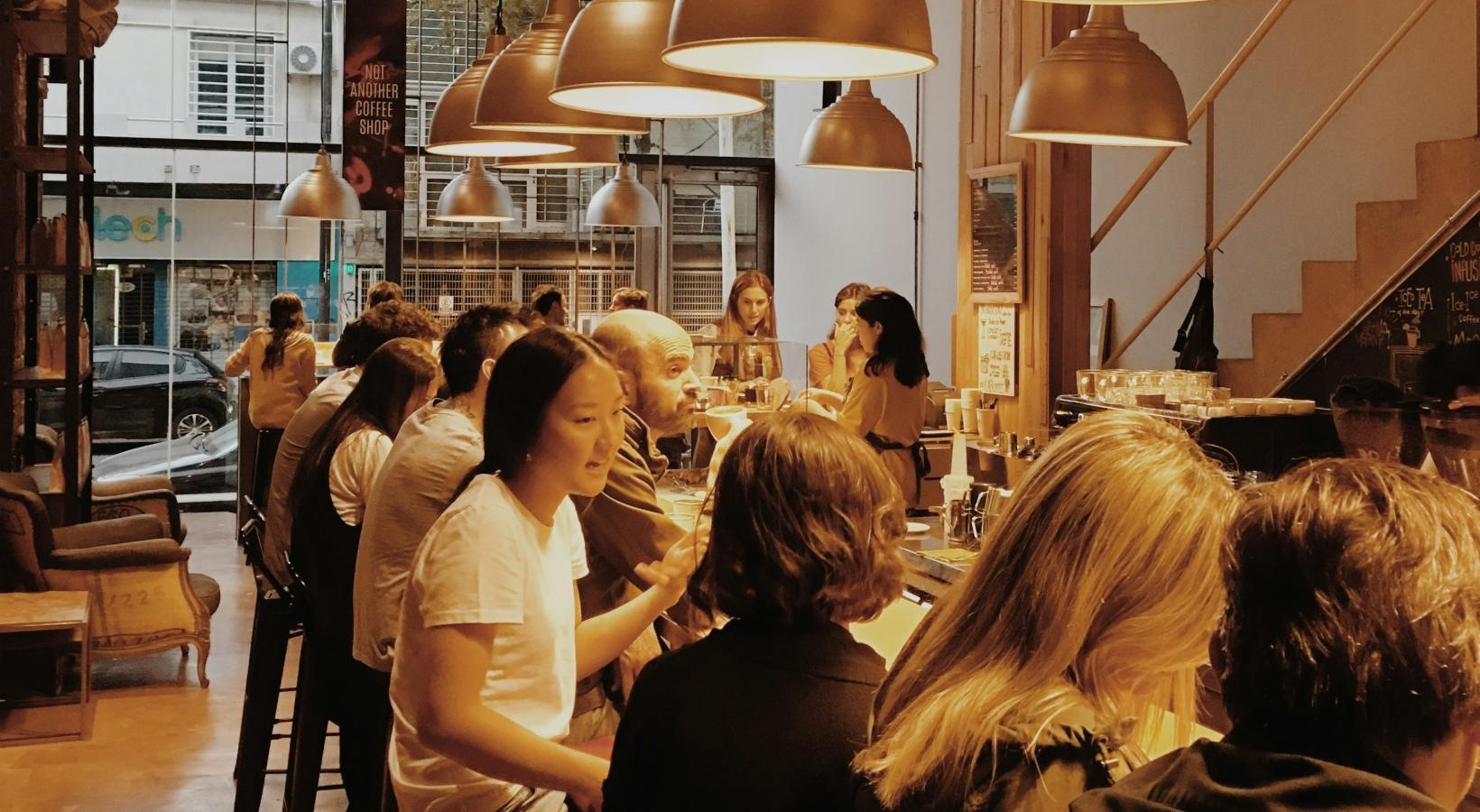 Bustling community with plenty of dining choices a group of people in a restaurant