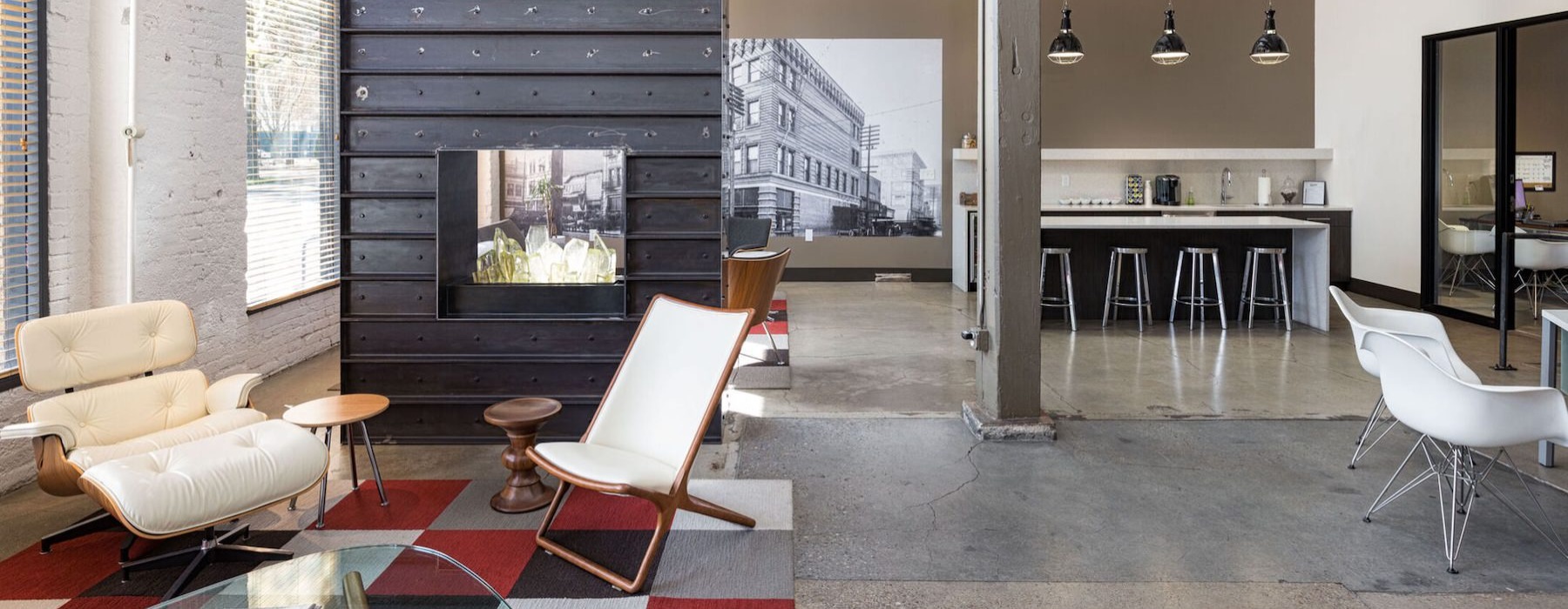 a clubhouse room with a couch and chairs
