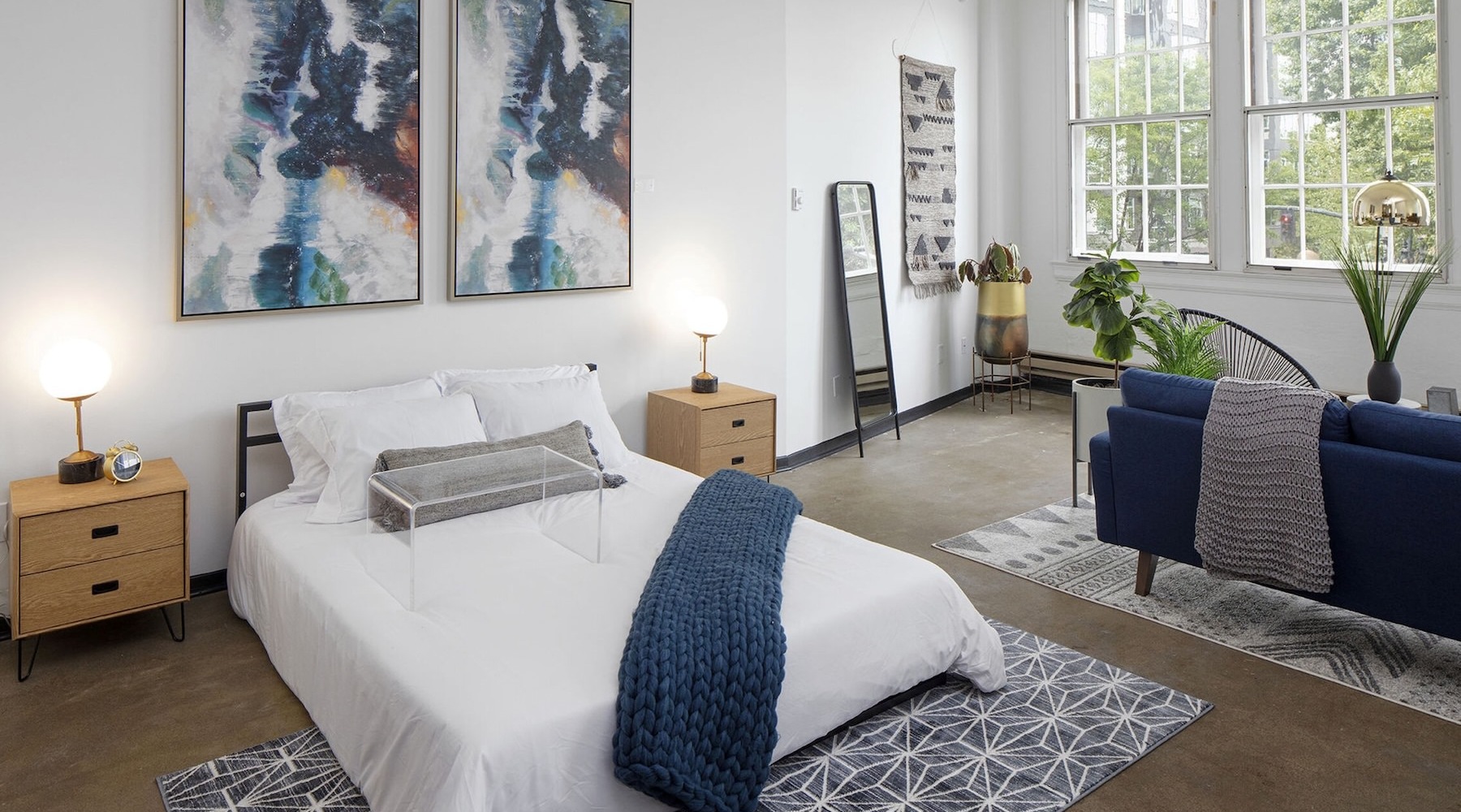 Beautiful living areas to match your lifestyle a studio area with a bed and a couch