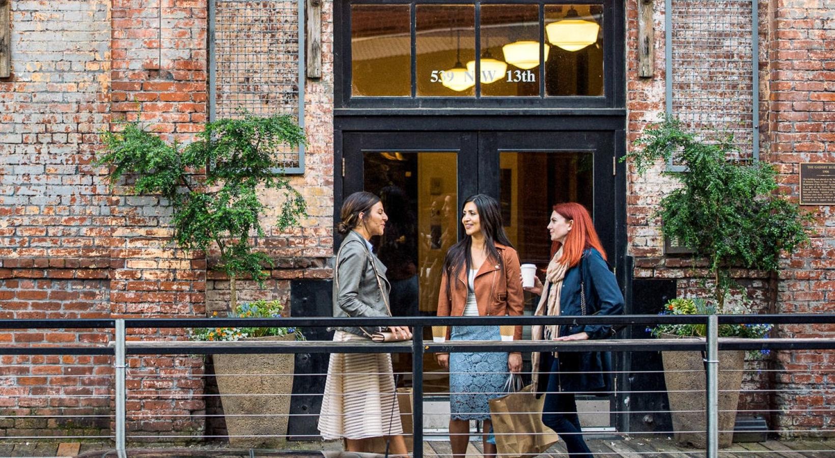 The essence of exceptional living a group of women standing outside a building