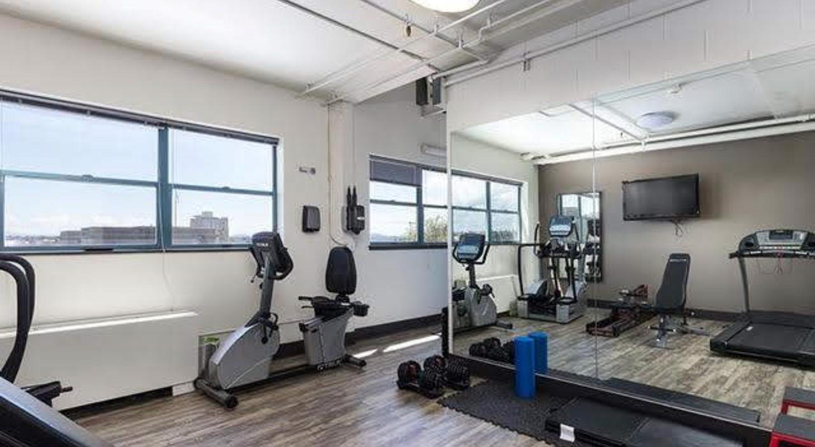 Everything within reach a gym with exercise equipment