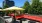 a patio with tables and chairs and umbrellas