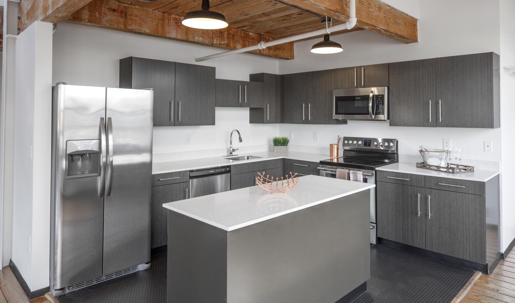 Spacious kitchens with thoughtful details a kitchen with black cabinets