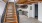 a kitchen with a staircase leading upstairs