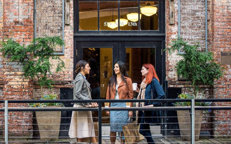 a group of women standing outside a building