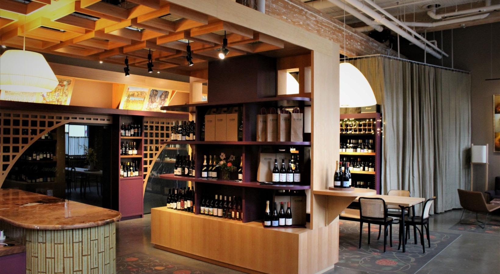 Vibrant community life with a variety of dining options a restaurant with wine bottles and chairs