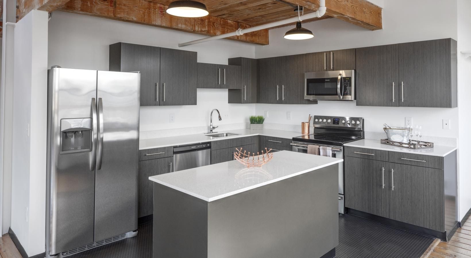 Spacious kitchens with thoughtful details a kitchen with black cabinets