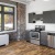 a kitchen with a brick wall