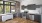 a kitchen with a brick wall