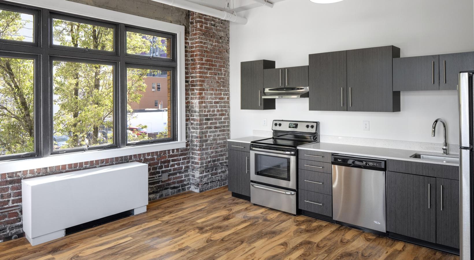 Gorgeous living areas to entertain and enjoy a kitchen with a brick wall