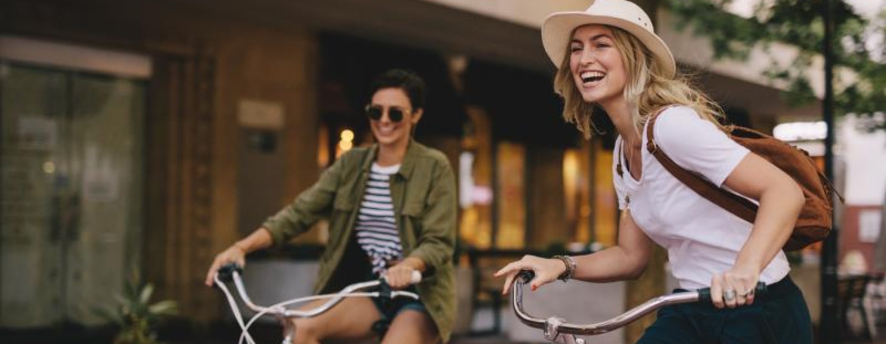 two women riding bikes