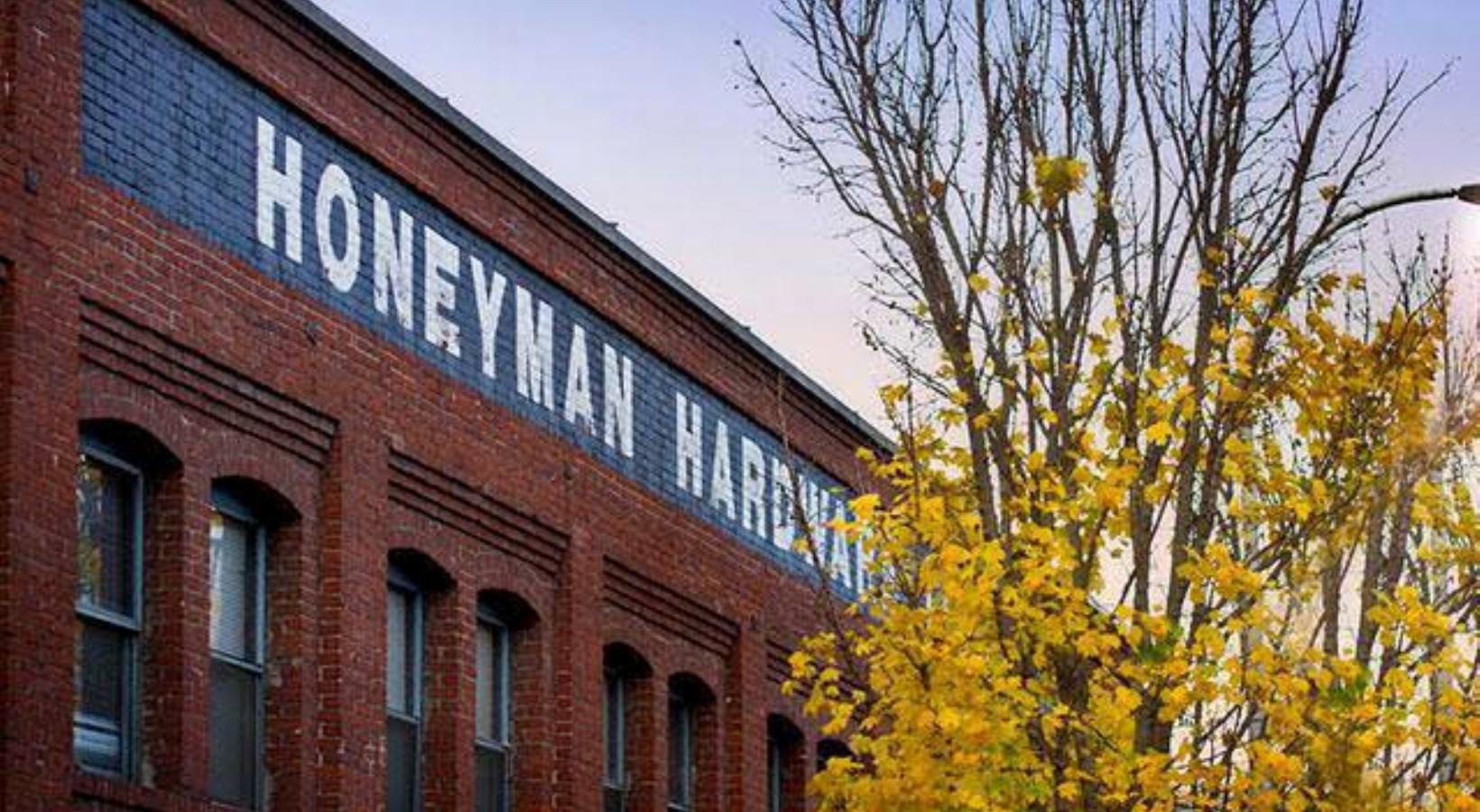 Settle into comfort at Honeyman Hardware Lofts a building with a sign on it