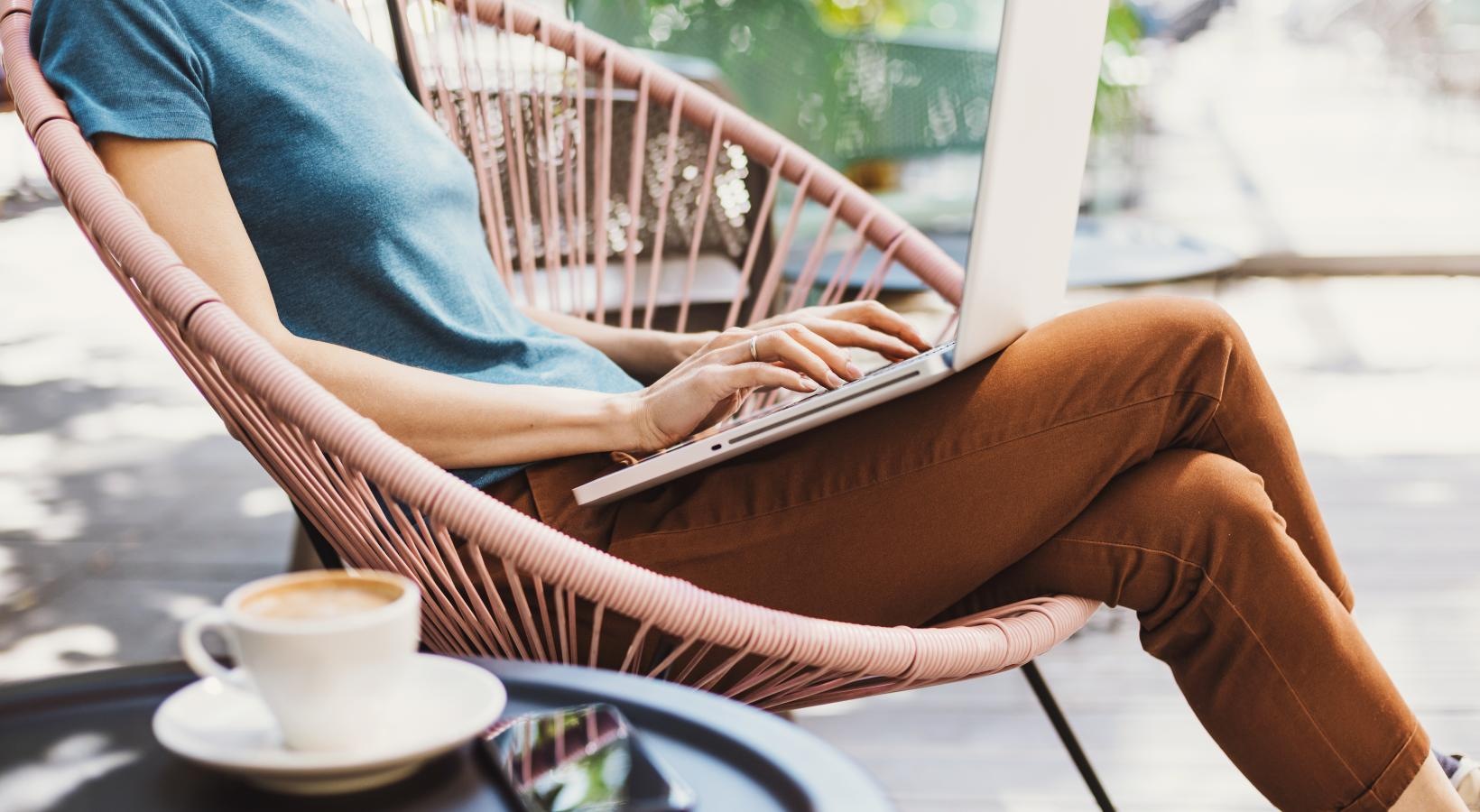 The essence of exceptional living a person sitting on a chair using a laptop