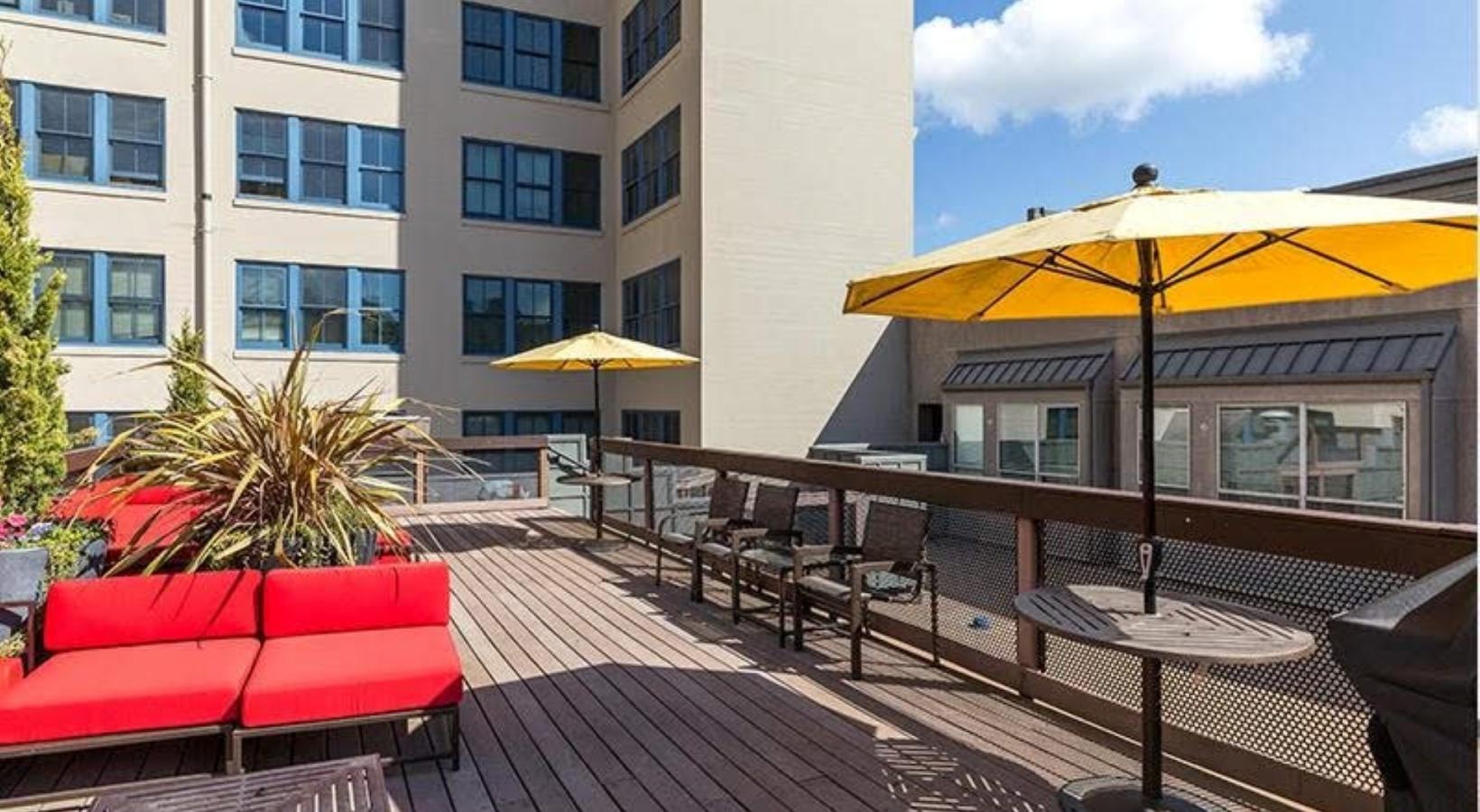 State-of-the-art amenities a deck with chairs, tables and umbrellas