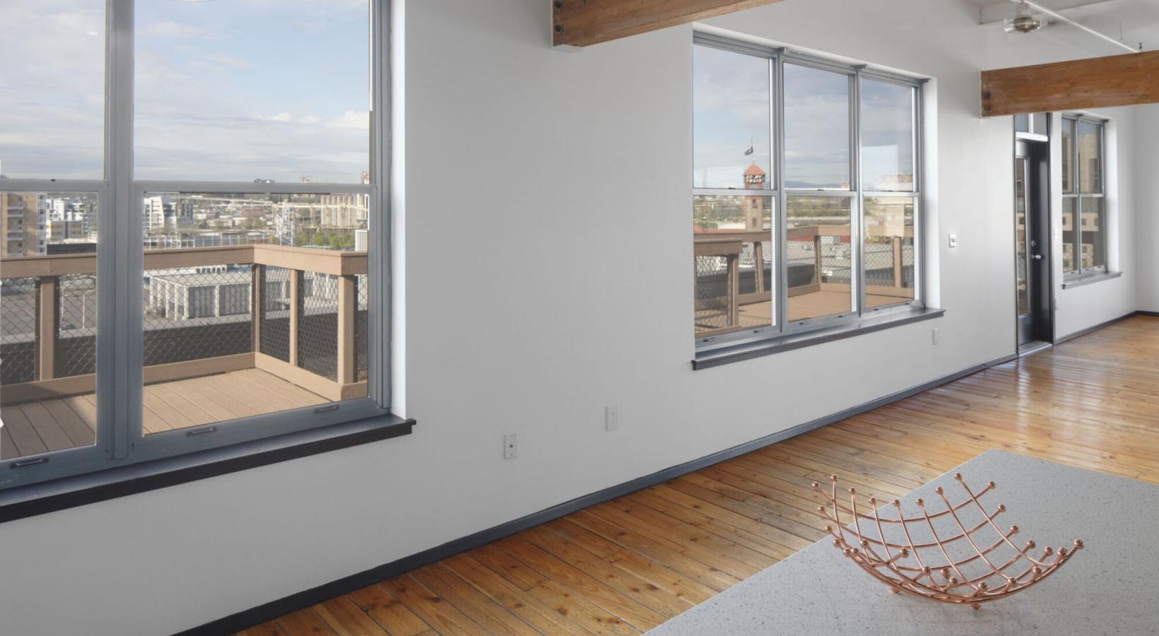 Generous living spaces with beautiful natural lighting a living room with a large window
