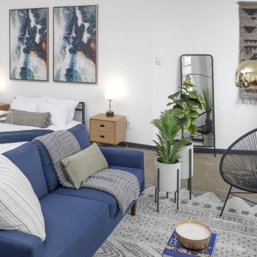 Generous living spaces to relax and unwind a living room with a blue couch