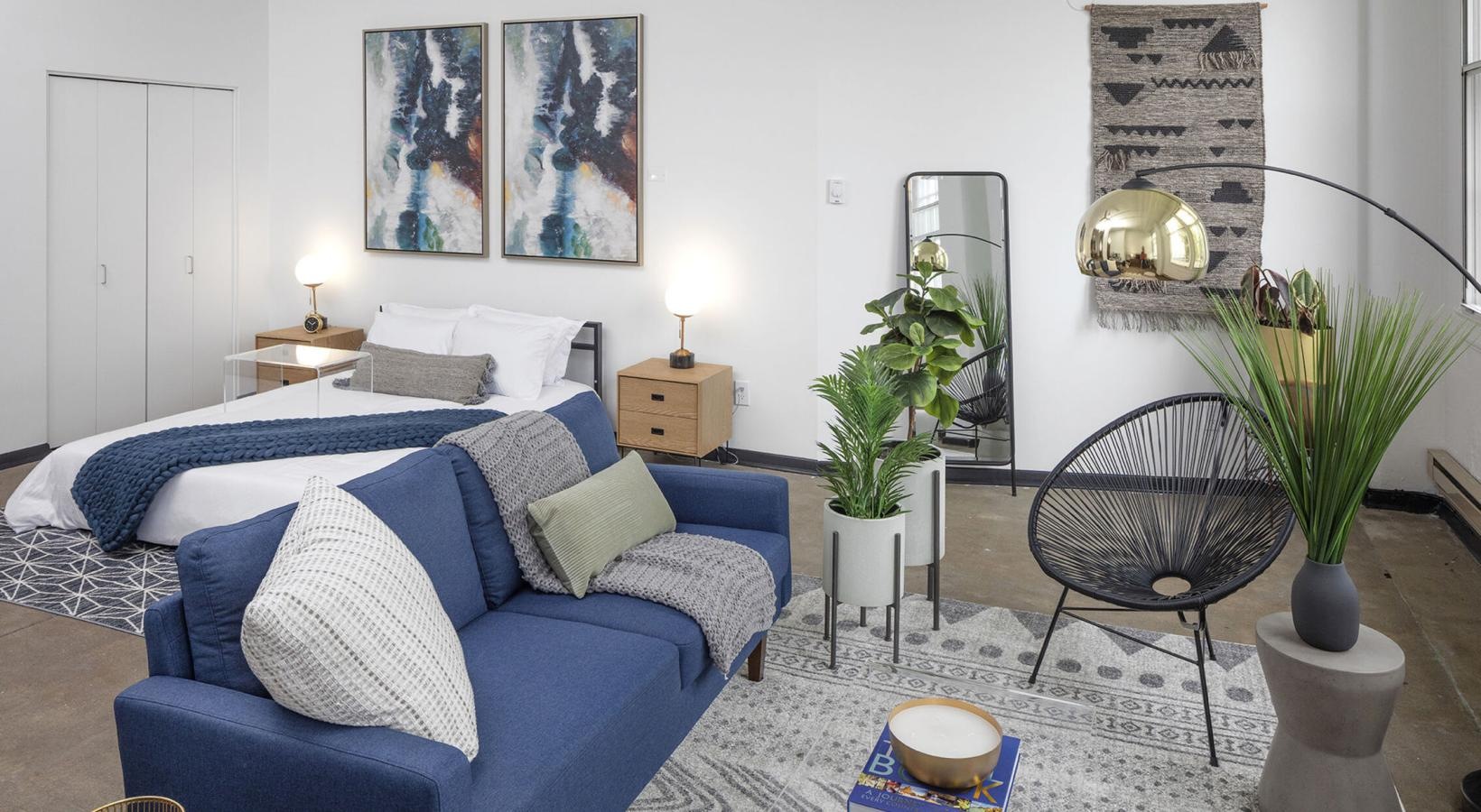 Generous living spaces to relax and unwind a living room with a blue couch